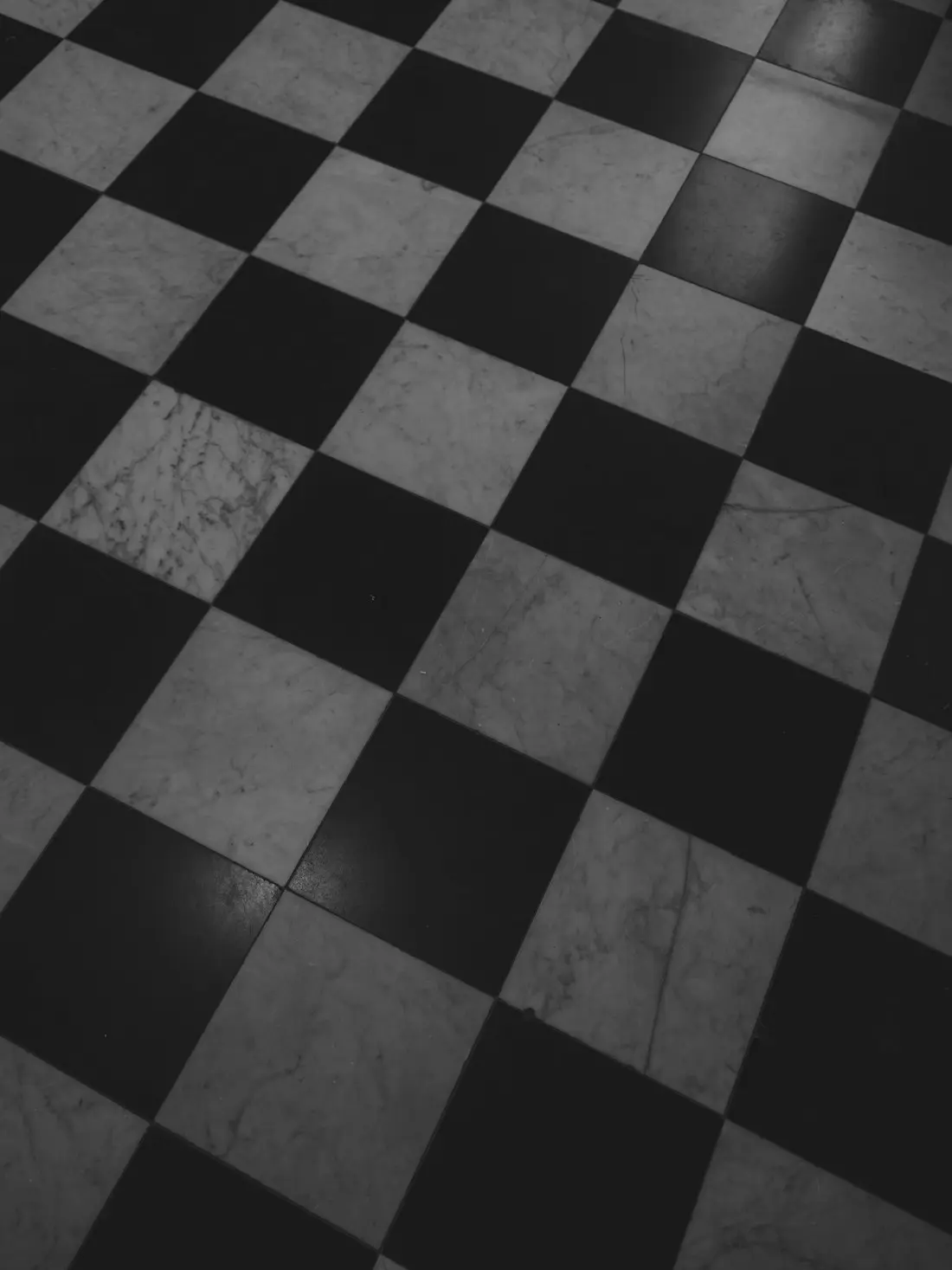 Marble checkerboard entry — Carrara and Nero Marquina, 12×12 in.